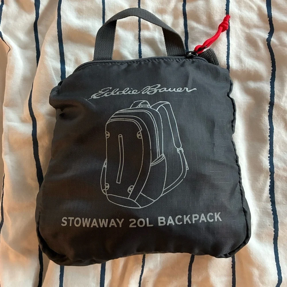 EDDIE BAUER STOWAWAY PACKABLE 20L BACKPACK in black with red piping